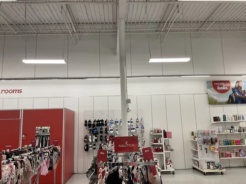 Linear LED fixtures suspended over the intimates and fragrance sections at the Bealls store