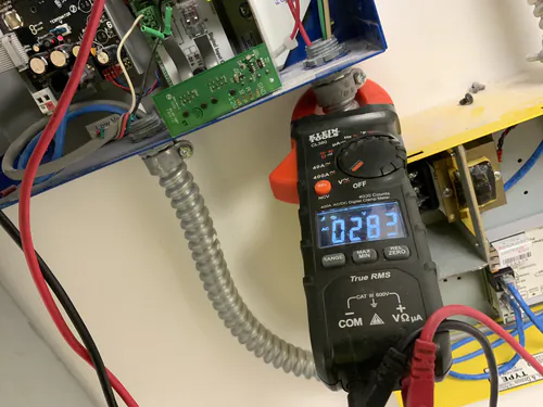 Klein Tools CL380 clamp meter reading 283 volts at the Bealls lighting control panel
