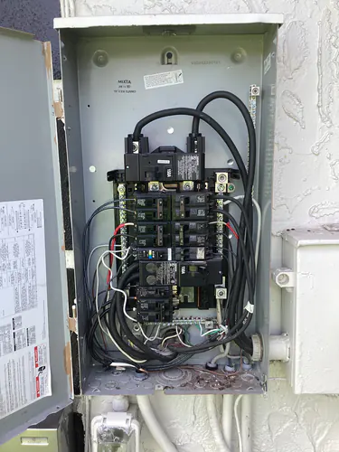 Open Siemens outdoor load center with a 150 amp main breaker during the Longwood outdoor rewiring