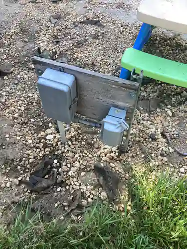 Weatherproof receptacle and enclosure mounted on a staked post beside the play area at the Mount Dora outdoor outlet project