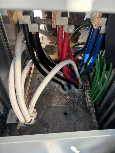 Copper bus bars and feeder terminations inside the EMS warehouse switchboard