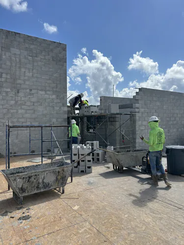 Masons laying block on the upper floor of the Hawthorne Heights apartment building