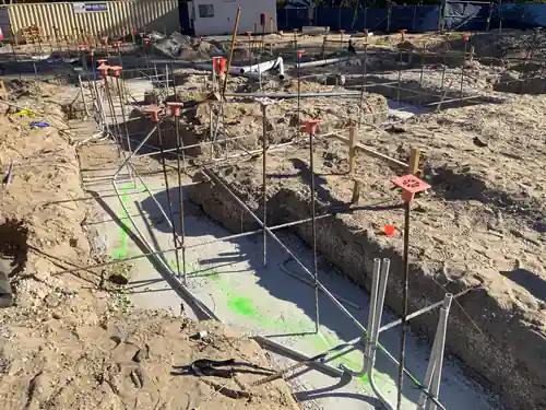 Footing trench at Hawthorne Heights with rebar dowels, conduit stub ups and a formed slab edge