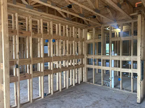 Wood framed apartment interior at Hawthorne Heights with device boxes set in the studs