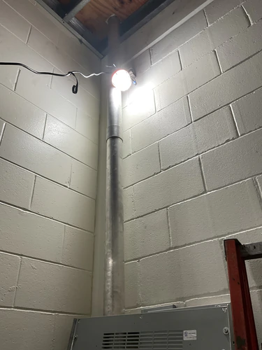 Rigid conduit riser down a block wall to an enclosure at the Hunter's Creek water facility