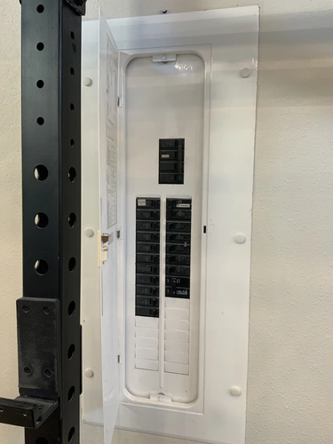 Finished Winter Park panel cover with the main breaker block, an Air Handler label and filler plates over the unused spaces
